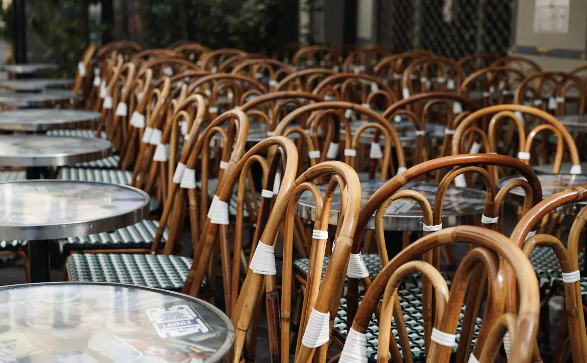 Rows of rattan bistro chairs on the terrace